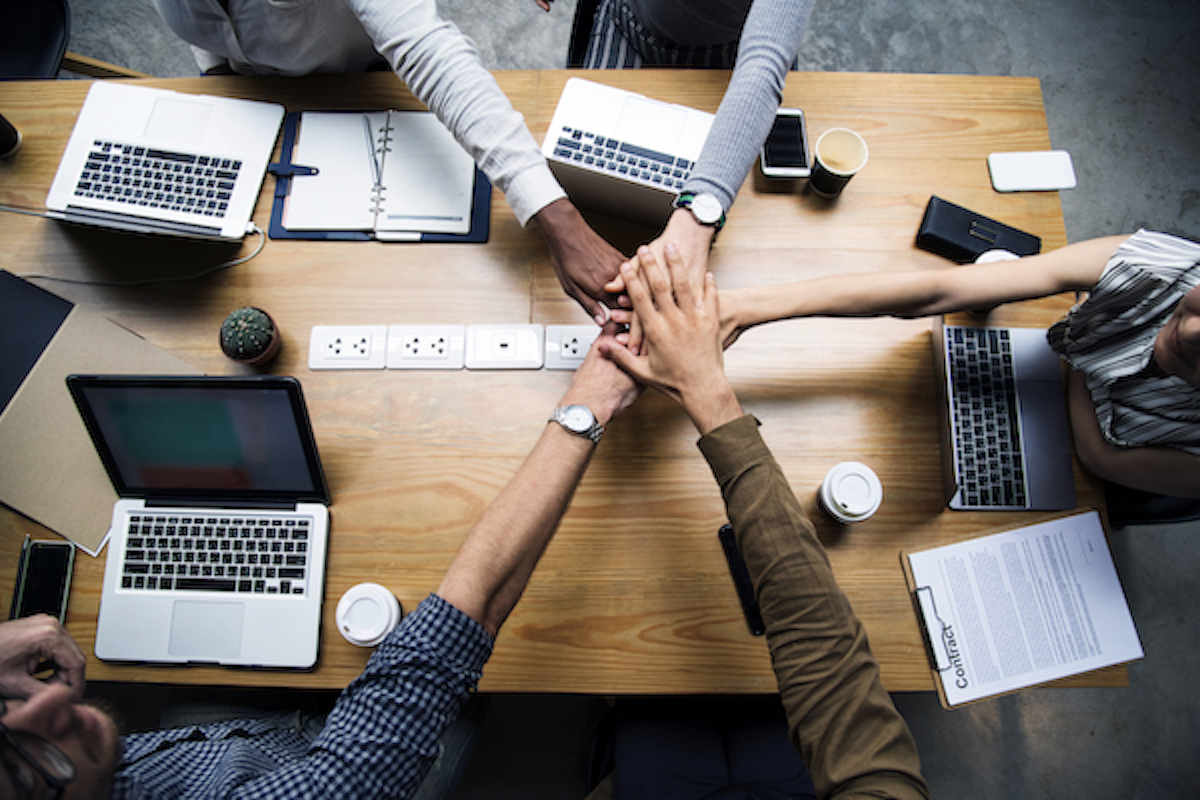 team-business-people-stacking-hands