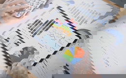 businesswoman-using-tablet-analysis-graph-company-finance-strategy-statistics-success-concept-planning-future-office-room